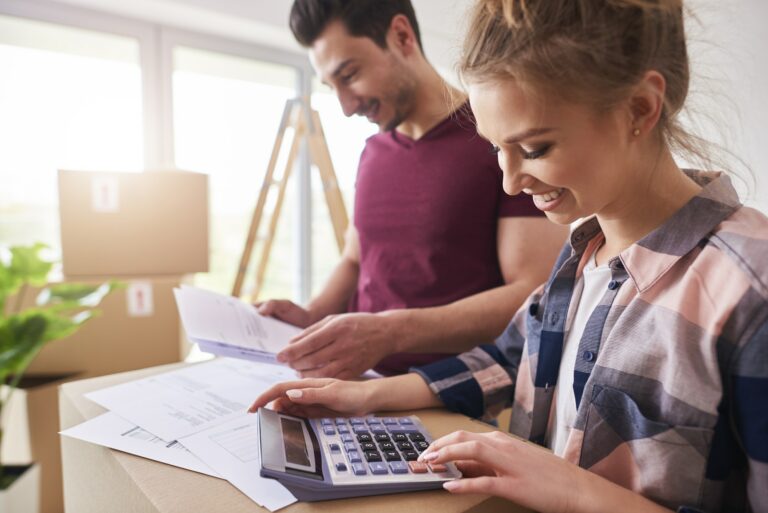 Happy couple planning their budget