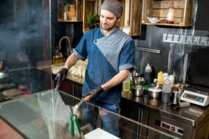 Chief cook cooking at the asian kitchen